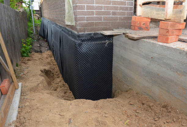 Happy homeowners after waterproofing job in Graytown